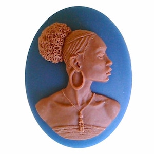 May include: A brown cameo of a woman with a bun, large earrings, and a necklace on a blue background.
