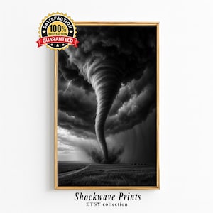 May include: A framed black and white wall art print depicting a large tornado over a field with a lightning bolt in the dark sky. A circular badge in the top left corner reads 100% SATISFACTION GUARANTEED. The text Shockwave Prints ETSY collection appears below.