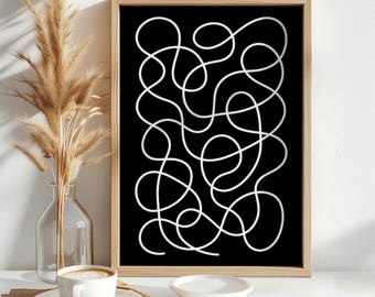 Puede incluir: Una lámina de arte mural enmarcada que presenta una línea blanca continua que forma un patrón abstracto intrincado, enredado y con bucles sobre un fondo negro sólido. El marco rectangular está hecho de madera clara con un acabado natural.