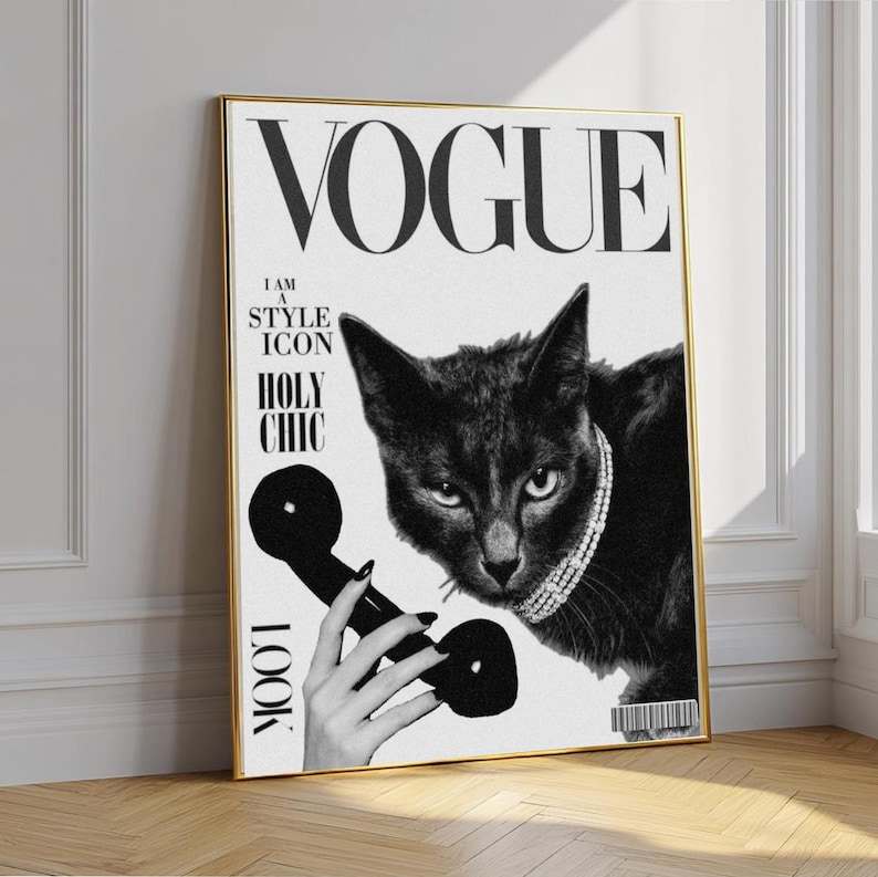 May include: Black and white Vogue magazine cover art featuring a black cat wearing a pearl necklace and holding a vintage telephone. The text includes "VOGUE", "I AM A STYLE ICON", and "HOLY CHIC". The artwork is framed in gold.