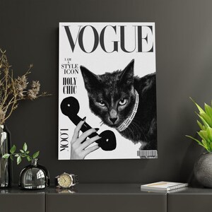 May include: Black and white Vogue magazine cover featuring a black cat wearing a pearl necklace and holding a telephone receiver. The cover includes the Vogue logo and the phrases "I AM A STYLE ICON", "HOLY CHIC", and "LOOK".