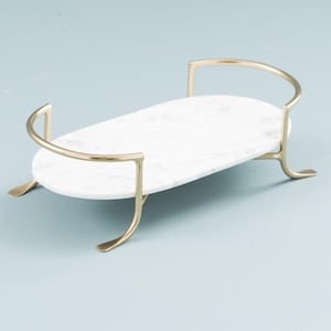 Oval marble tray organizer styled on coffee table