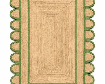 May include: A rectangular area rug crafted from natural tan woven fibers, featuring a distinct scalloped edge border. The rug is accented with a vibrant green trim that outlines the central rectangular section and defines each individual scallop.