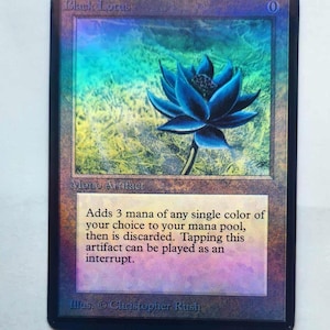 May include: A Black Lotus card with a black border and a holographic sheen. The card features a blue lotus flower illustration and text that reads "Black Lotus" and "Mono Artifact". The card's text describes its function in the game.
