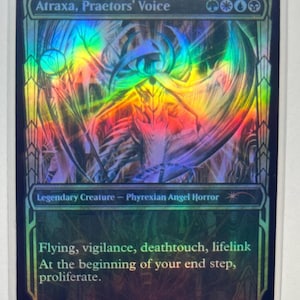 May include: A holographic Magic: The Gathering card featuring Atraxa, Praetors' Voice. The card has a colorful, iridescent design with text that reads "Flying, vigilance, deathtouch, lifelink." The card is a Legendary Creature - Phyrexian Angel Horror.