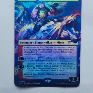 May include: A Magic: The Gathering card featuring Minsc & Boo, Timeless Heroes. The card has a blue and green color scheme with a fantasy illustration of a warrior and a hamster. Text includes card abilities and the Planeswalker designation.