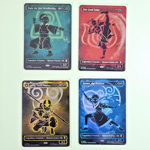 May include: Four trading cards featuring characters from Avatar: The Last Airbender. Each card has a different character illustration in black and gold, with text including character names and stats. The cards are set against backgrounds of blue, red, and gold.