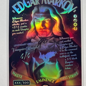 May include: A holographic trading card featuring Edgar Markov, a Vampire Knight. The card has a portrait of a vampire with long hair and the text "Edgar Markov" at the top. The card includes game text and stats.