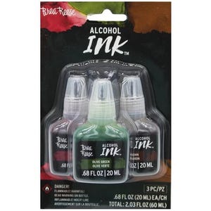 May include: A package of three Brea Reese Alcohol Ink bottles. The set includes Olive Green, Brown, and a reddish-purple ink. Each bottle contains .68 fl oz (20 ml) of ink. The packaging features the words "Alcohol Ink" and safety warnings.