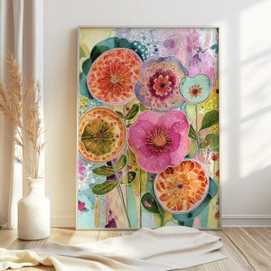 May include: A framed vertical wall art print featuring a vibrant, abstract floral composition. The artwork displays stylized flowers in shades of orange, pink, purple, and teal, with intricate line work and the text Joyful Living in the corner.