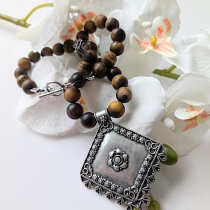 Tribal necklace with Pre-Columbian style - Matte tiger eye beads and statement zamac pendant - Approximately 46 cm length