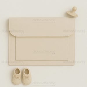 May include: A cream-colored baby accessory set, including a pacifier, a folio-style case, and a pair of small shoes. The items are arranged on a light background. The case has a flap closure and a pocket. The shoes have laces.