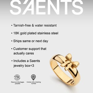 Peut inclure: Une bague dor&eacute;e avec un motif de n&oelig;ud. La bague est en acier inoxydable plaqu&eacute; or 18 carats et est r&eacute;sistante &agrave; la ternissure et &agrave; l'eau. Le mot "SAENTS" est affich&eacute; en haut de l'image.