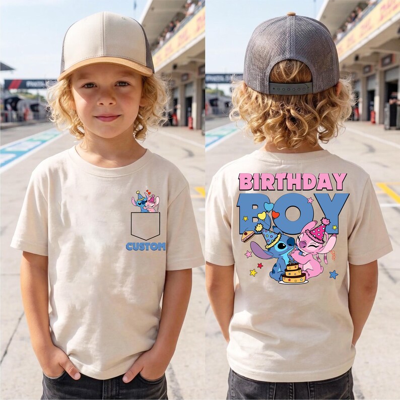 May include: Beige short-sleeved t-shirt with a pocket design featuring cartoon characters. The word "CUSTOM" is below the pocket. The back of the shirt says "BIRTHDAY BOY" with cartoon characters and a cake.