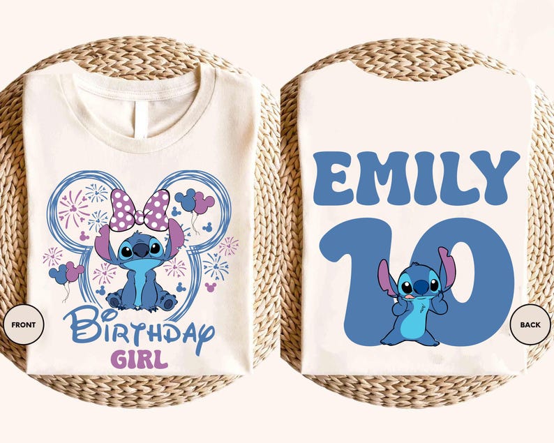 May include: A white t-shirt featuring a blue cartoon character design. The front of the shirt has the text "Birthday Girl" and a character illustration. The back of the shirt has the name "Emily" and the number "10".