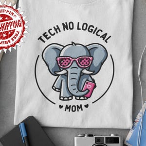 Camiseta unisex con diseño de elefante de dibujos animados, diseño de elefante divertido, regalo familiar, color rosa y gris.