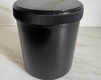Black plastic container with leak protection and screw-on lid