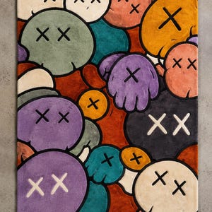 Handmade tufted rug featuring colorful abstract cartoon faces with X eyes, modern street art inspired design, soft textured area rug for bedroom, living room, gaming room, and contemporary home decor.