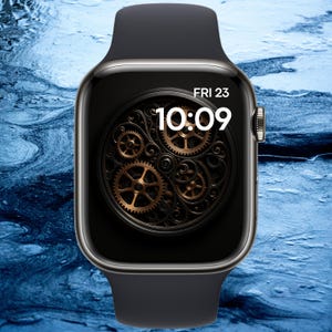 May include: Black smartwatch with a dark face displaying the time 10:09 and the date Fri 23. The watch face features a detailed gear design in shades of gold and black. The watch has a black band and a silver-colored side button.