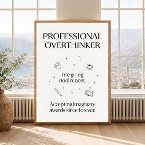 May include: A framed vertical wall art print with a white background and black text. The text reads PROFESSIONAL OVERTHINKER, l'ite giring noolncocet, and Accepting imaginary awards since forever. Icons include a head with gears, a cup, a pen, and a book.