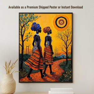 May include: A framed wall art print depicting two figures walking along a path in a landscape with a bright orange sun. The figures wear patterned orange skirts and headwraps. The scene includes dark silhouetted trees against a vibrant yellow sky.