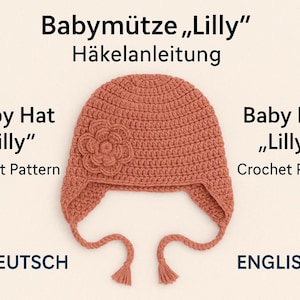 May include: A crocheted baby hat in a terracotta color, featuring a flower applique on the front and ear flaps with tassels. The text on the image reads "Baby Hat Lilly Crochet Pattern".