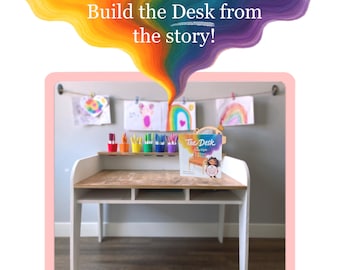 Op de afbeelding: Een witte bureau met een licht houten blad en een ingebouwde plank. Op de bureau ligt een boek met de titel "The Desk", samen met kleurrijke stiften en tekeningen. De afbeelding bevat de tekst "Build the Desk from the story!" en een regenboogontwerp.