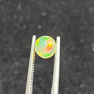 Natural Ethiopian opal round, calibrated cabochon, rainbow play of color