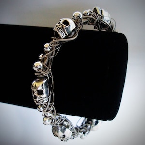 Deluxe Guitar String Bracelet w/ Tibetan Silver Skulls