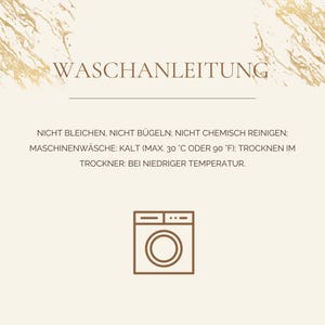 May include: A beige informational card with gold marble-style corners featuring the German text WASCHANLEITUNG and laundry care instructions including no bleaching, no ironing, no dry cleaning, machine wash cold at 30 C or 90 F, and tumble dry low.