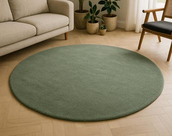 Alfombra redonda minimalista de lana tejida a mano, color verde salvia, estilo biofílico para la decoración de la sala de estar.