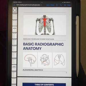 May include: A digital tablet showing a study guide on Basic Radiographic Anatomy. The screen displays a skeletal illustration with a highlighted spine, and diagrams of the brain, heart, and lungs. The text "RADIOLOGIC TECHNOLOGY STUDENT STUDY GUIDE" is visible.