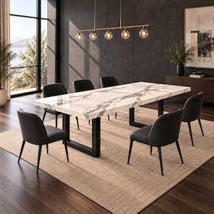 May include: A rectangular dining table with a white marble top featuring grey and gold veining, supported by two black metal U-shaped legs. Six black upholstered chairs with curved backrests are arranged around the table on a textured rug.