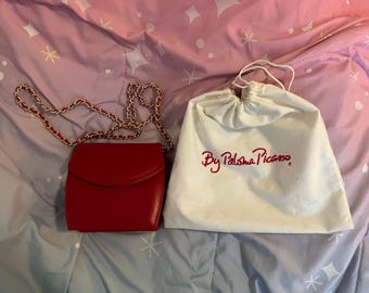 Paloma Picasso red crossbody purse and a drawstring bag from Spain