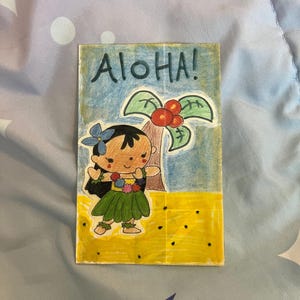 May include: Hand-drawn illustration of a cartoon girl in a grass skirt with a blue flower in her hair, standing in front of a palm tree. The word "Aloha!" is written above the girl. The background is blue and yellow.