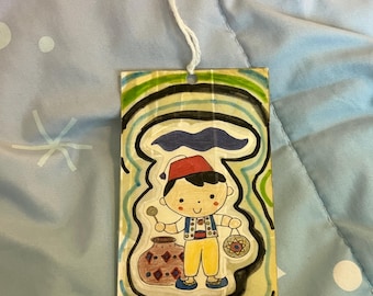 A young Moroccan musician original artwork handmade bookmark