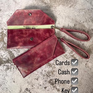 Cartera de muñeca ligera de piel roja con forro de gamuza
