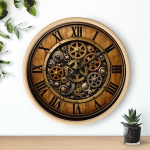 May include: A round wall clock with a steampunk design. The clock face has a wooden background with Roman numerals and a central display of intricate gears in gold and bronze. The clock has a light-coloured wooden frame.
