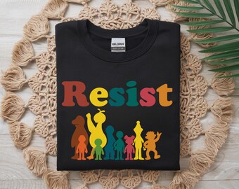Camiseta "Salven a PBS", "Resistan", "Salven a la radiodifusión pública", "Salven a PBS", "Letrero de jardín", "Resistan a Barrio Sésamo", "Resistan ...