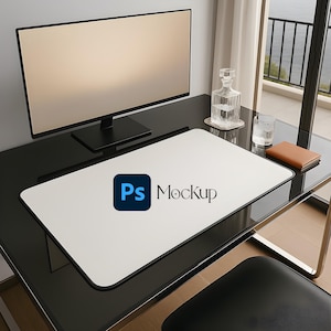 May include: A modern desk setup featuring a large computer monitor, a white mousepad with the text "Ps Mockup", a glass decanter, a drinking glass, and a small brown notebook. The desk is black and has a glass top.