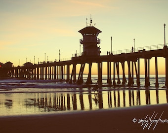 California Summer Sunset - Surfer walking under the HB Pier as the sun sets 8x12 photo