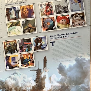 May include: A Celebrate the Century 1980s commemorative stamp sheet featuring fifteen 33-cent stamps depicting cultural icons like E.T., Cabbage Patch Kids, and the space shuttle. The sheet includes historical text and a large image of a shuttle launch.