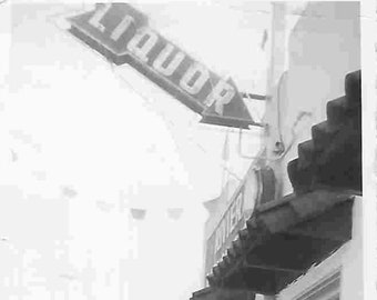 Vintage Midcentury Original Black & White Photo - Man at Liquor Store
