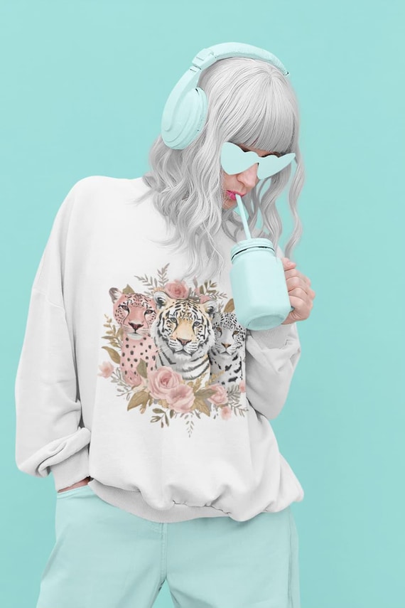 Where fierce meets feminine -  Introducing the Glam Jungle Sweatshirt. Three icons.