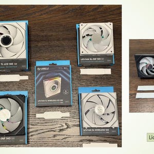 May include: An assortment of Lian Li fan covers, displayed on a wooden surface. The fans are in various sizes and colors, including black and white. The packaging includes the text "Lian Li Fan Covers".