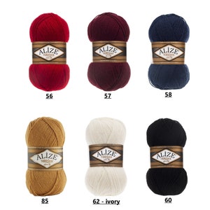 May include: Six skeins of yarn in various colors, including red, burgundy, navy blue, beige, white, and black. Each skein has a label that reads "Alize superlana zincir".