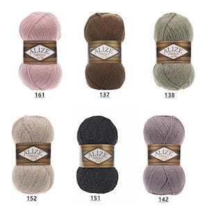 May include: Six skeins of yarn in various colors, including pink, brown, green, beige, gray, and purple. Each skein has a white label with the word "ALIZE" and the text "superlana" in black. The numbers 161, 137, 138, 152, 151, and 142 are printed below each skein.