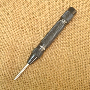 Husky automatic center punch outlet