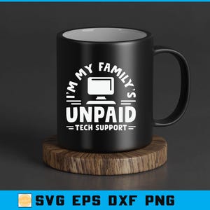 May include: Black ceramic mug with the text "I'M MY FAMILY'S UNPAID TECH SUPPORT" in white. The mug sits on a round wooden coaster. The mug has a black handle and a white interior.