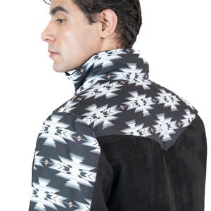 May include: Black and white patterned shirt with a suede-like black panel. The shirt features a geometric design on the collar and upper back. The model is facing away from the camera.